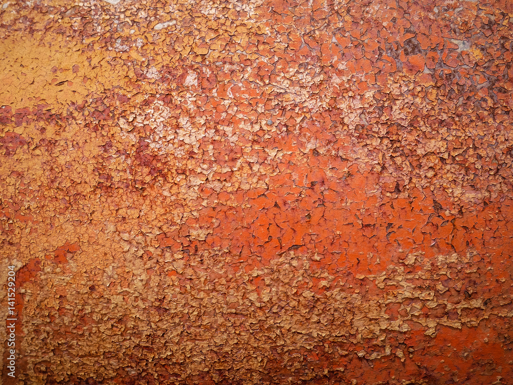Detail and close up of rust on car metal with cracking, presence of rust and corrosion, beautiful abstract background with cracked and chiped painting, natural art creation