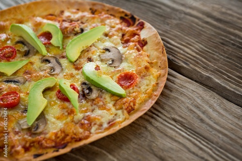 Italian pizza on a wooden plank