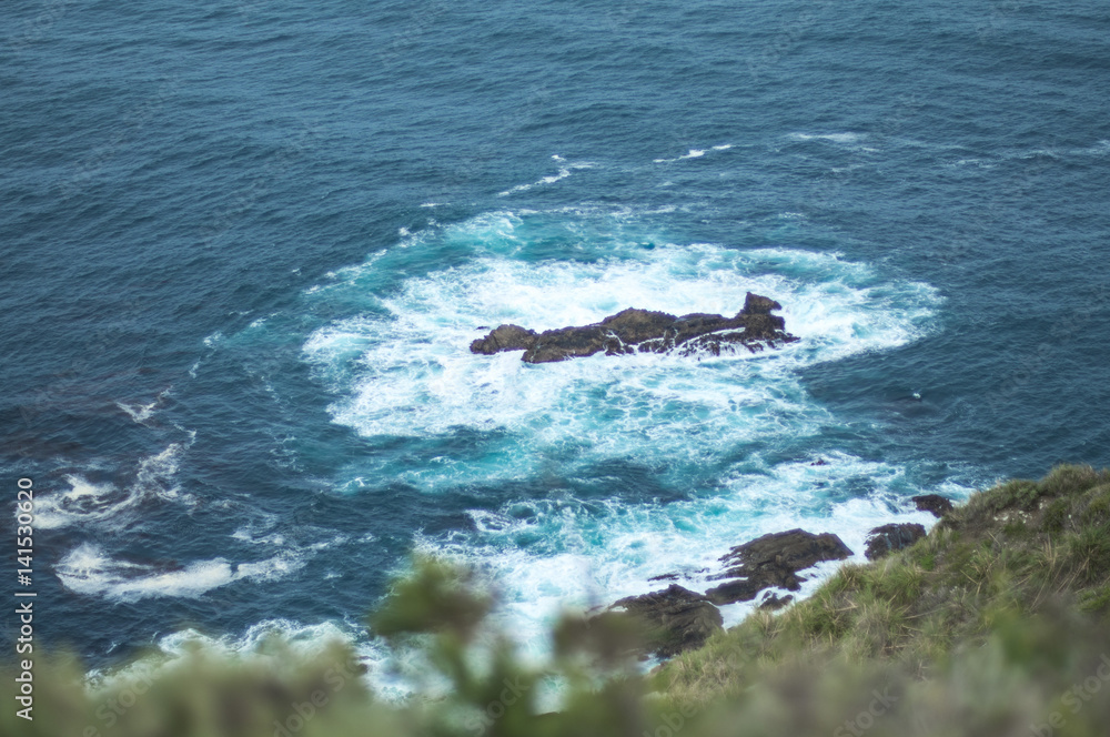 Naklejka premium rocks in ocean swirl