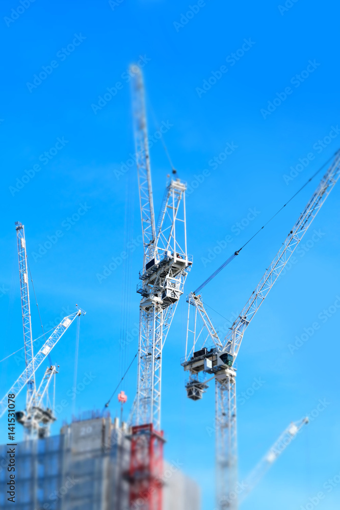 Miniaturised Shot Of Construction Site With Tower Cranes