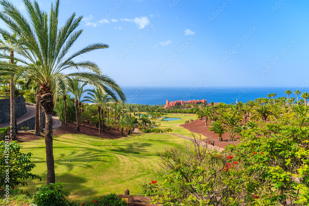 Golf course in tropical landscape of Tenerife island near San Juan town, Spain
