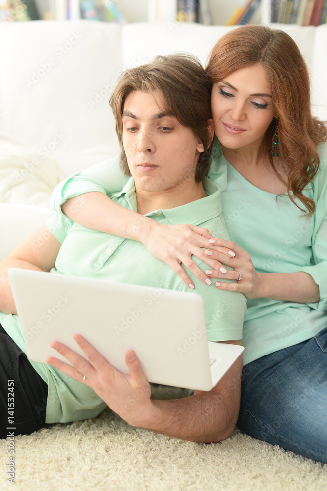 Beautiful young couple with a laptop Beautiful young couple with a laptop