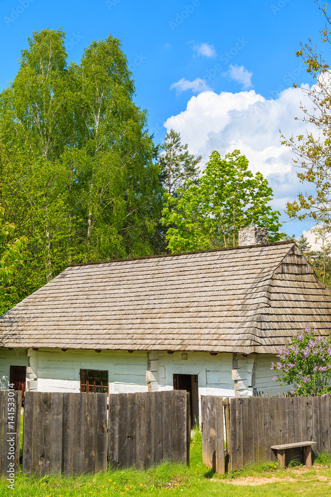 Old traditional house with straw roof in Tokarnia village on sunny spring day, Poland Old traditional house with straw roof in Tokarnia village on sunny spring day, Poland