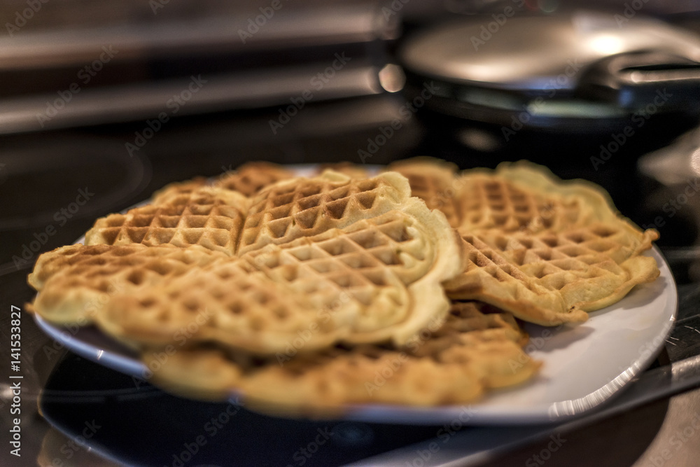 Baking Homemade waffles cooked in a waffle iron Baking Homemade waffles cooked in a waffle iron