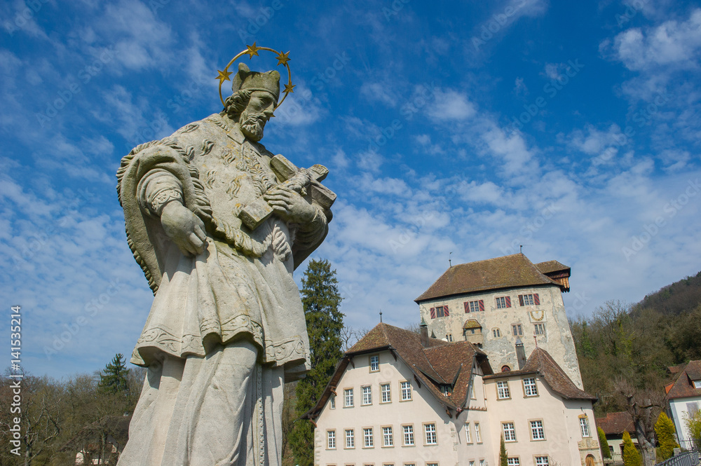 Statue of John of Nepomuk with the Castle Rotwasserstelz in the background , Hohentengen, Germany
