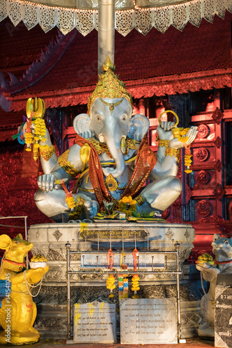 Ganesha god statue in Wat Srisuphan temple in Chiang Mai, Thailand, Ganesha God is elephant God in Hindu religion. © sirintra