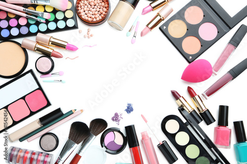 Different makeup cosmetics on white background