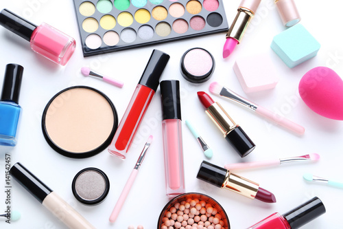 Different makeup cosmetics on a white background