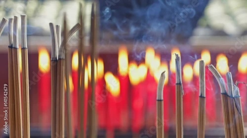 Smoke from incense sticks at chinese shrine slow motion