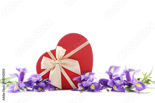 Bouquet of iris flowers with gift box on white background © 5second