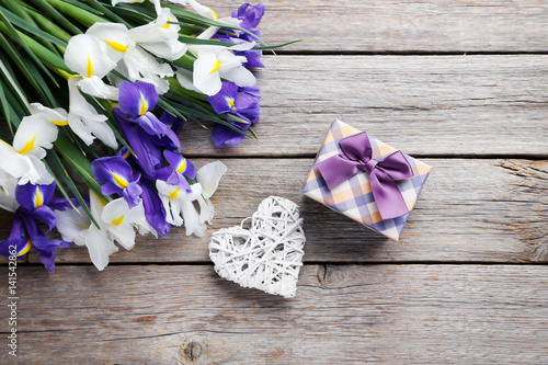 Fototapeta Naklejka Na Ścianę i Meble -  Bouquet of iris flowers on grey wooden table