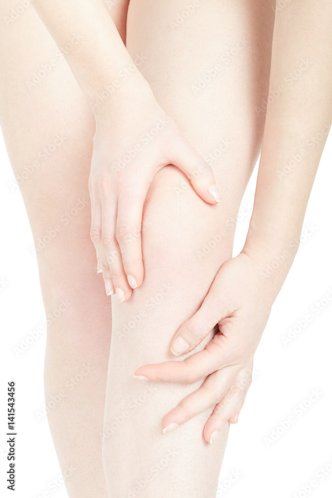 Young woman knee close up with hands isolated on white, clipping path Young woman knee close up with hands isolated on white, clipping path
