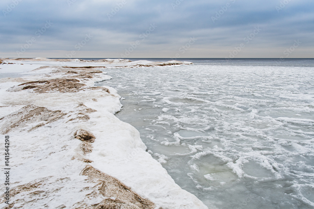 Lake Ladoga in winter. Everything is covered with ice and snow. Landscape. Russia.