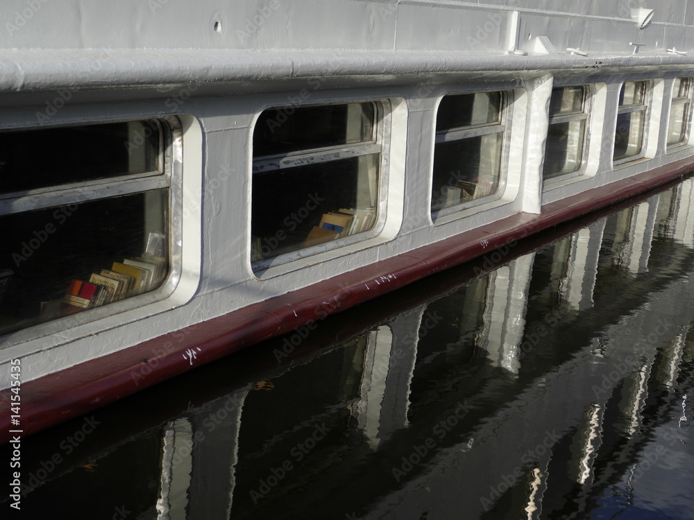 Fototapeta premium boat windows reflected in a water level