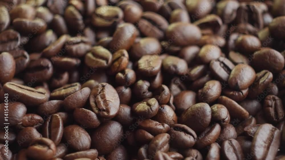 coffee beans on rotating stand closeup, slow motion