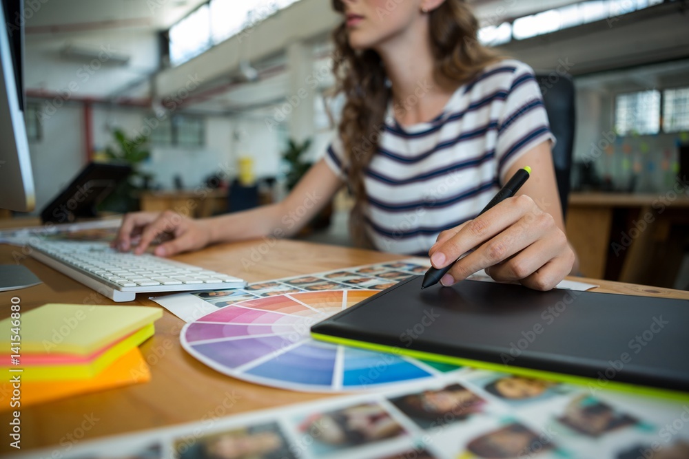 Fototapeta premium Mid section of female graphic designer 