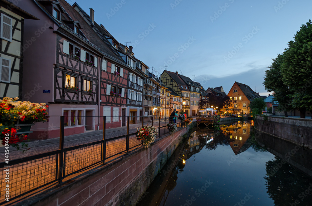 Quay channel in the city of Colmar. Alsace. France. There are colorful facades of old half-timbered houses.