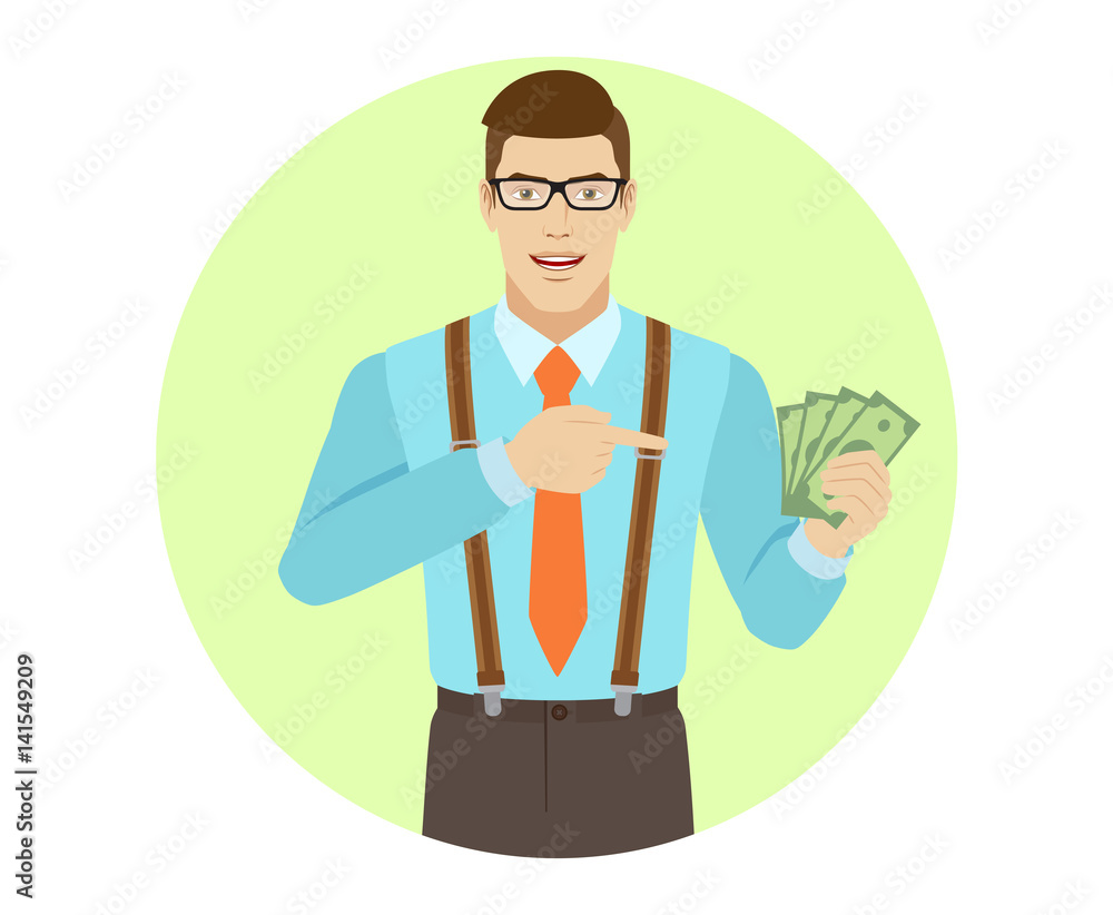 Businessman pointing at cash money in his hand