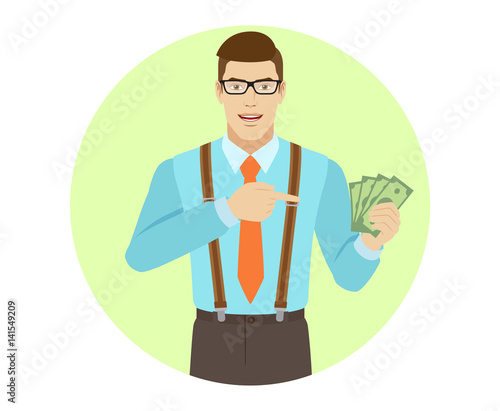 Businessman pointing at cash money in his hand