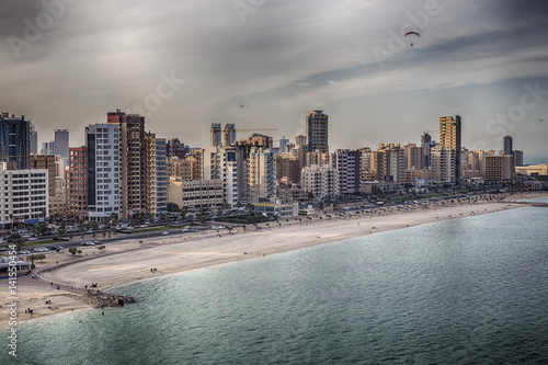 aerial view of a beach and city buildings