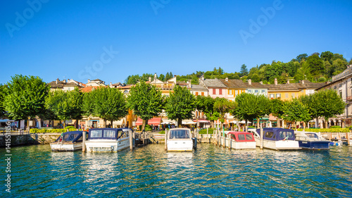 View of Motta square on Orta San Giulio from a touristic boat, Lake Orta, Piedmont, Italy © elitravo