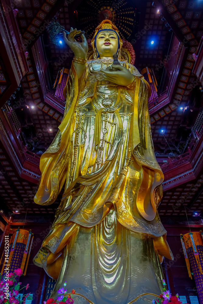 CHONGYUANG TEMPLE, CHINA - 29 JANUARY, 2017: Close up beautiful golden buddha statue, great detailed decorations, part of temple area