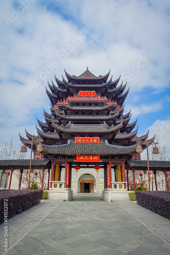 CHONGYUANG TEMPLE, CHINA - 29 JANUARY, 2017: Beautiful red and black tower with stunning chinese architecture, seen from medium distance on a nice sunny day