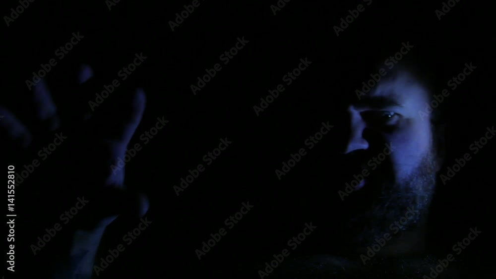 Evil and angry bald man speaking in darkness. 4K UHD Evil and angry bald man speaking in darkness. 4K UHD