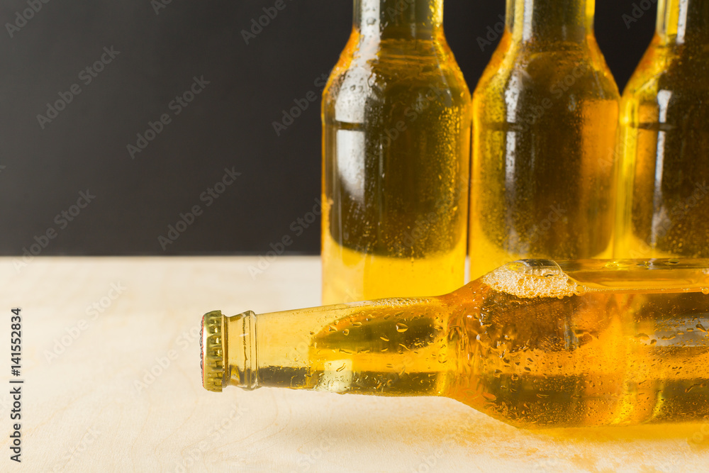 Fototapeta premium Beer bottles on a wooden table .