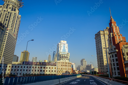 SHANGHAI, CHINA: Some tall modern buildings making up the horizon, walking on the streets of Shanghai