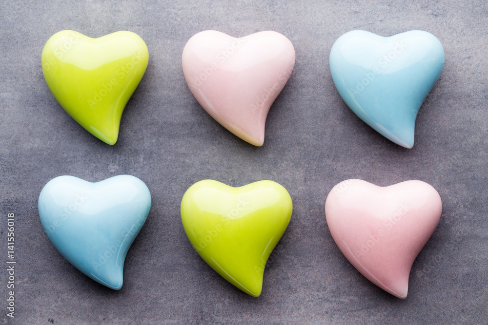 Colored heart on the gray background. View from above. Flat lay.