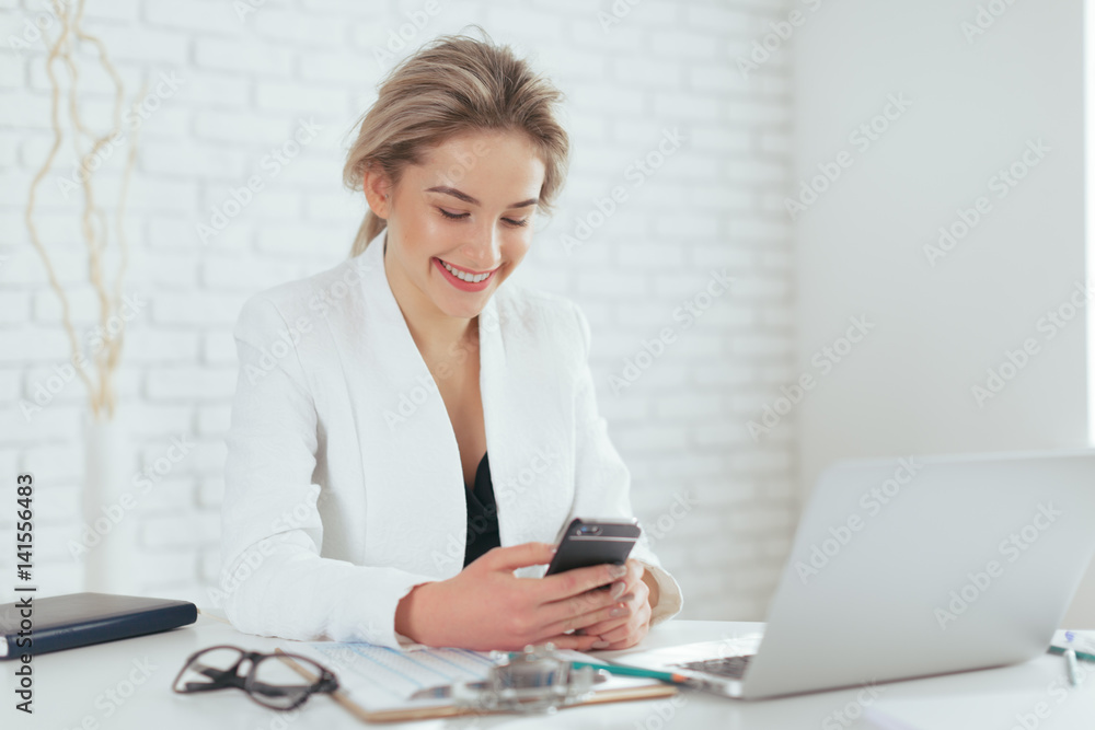 Portrait of beautiful young woman working in the office. Portrait of beautiful young woman working in the office.