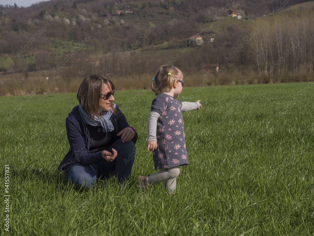 Mom and daughter in the meadow Mom and daughter in the meadow