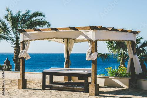 Fototapeta Naklejka Na Ścianę i Meble -  Relaxation area. Massage on the beach