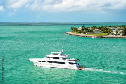 touristic yachts floating by green island at Key West, Florida © be free
