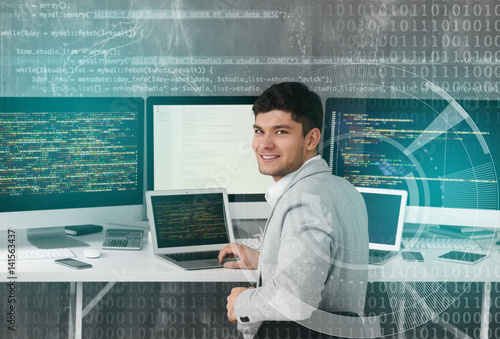 Handsome young programmer w...