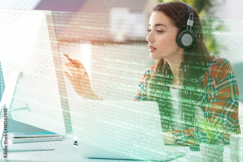 Young woman programmer work...