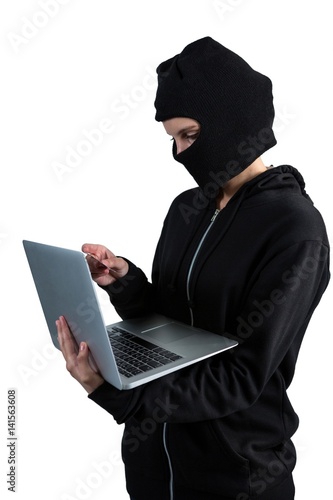 Hacker using laptop and credit card