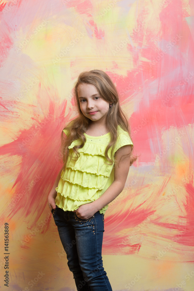 small baby girl with happy face in yellow shirt