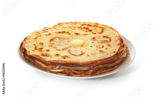 Pile of crepes on plate on white background