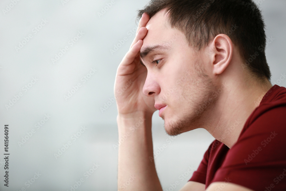 Handsome depressed man at home, closeup Handsome depressed man at home, closeup