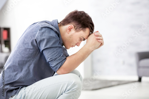 Εκτύπωση καμβά Handsome depressed man at home