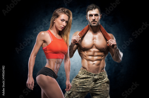 Athletic man and woman. Fitness couple.
