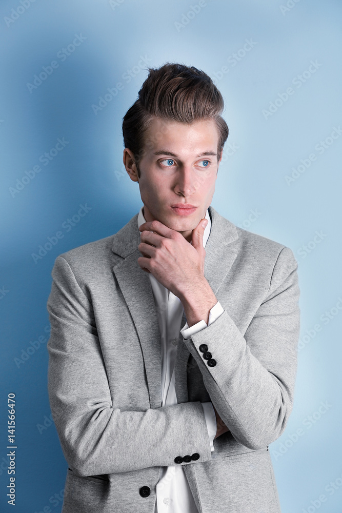 Handsome young man on color background Handsome young man on color background