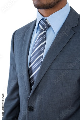 Businessman standing against white background