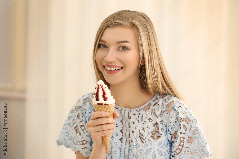 Beautiful young woman with ice cream on light background Beautiful young woman with ice cream on light background