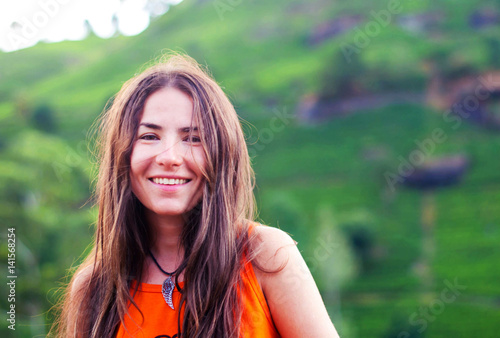 Cuadro en lienzo Beautiful girl without makeup with long hair smiles against the background of mo