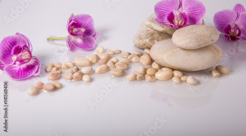 Spa background with stones and purple orchid