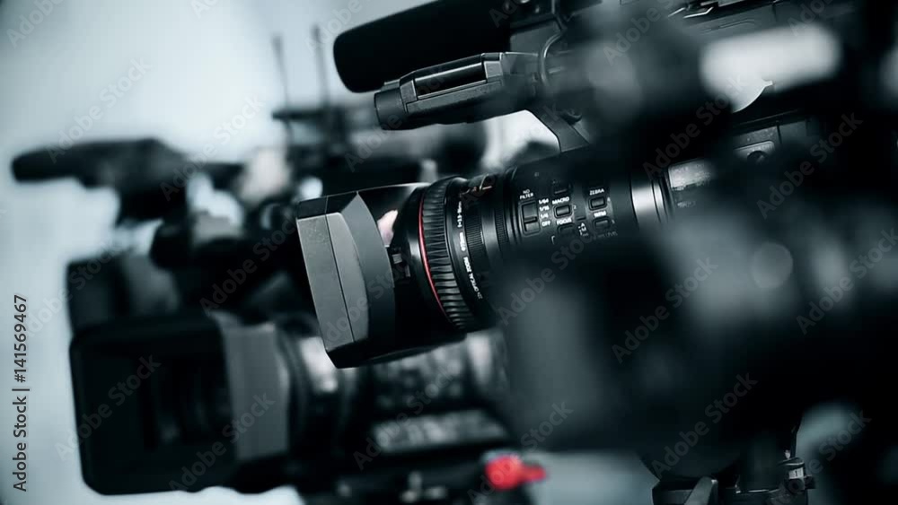 Television cameras in a row broadcasting a live media event