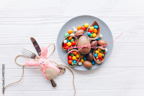 Easter concept. chocolate eggs and sweets on a white background